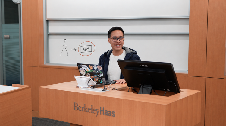 Kevin at a Berkeley Haas classroom with an illustrated discussion of human and agent product design